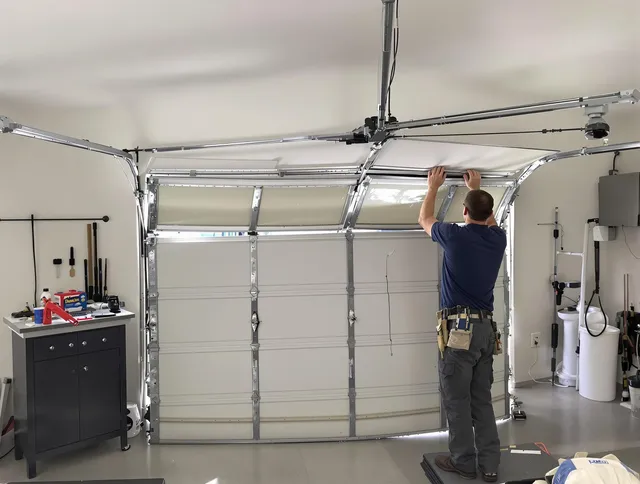 Port St. Lucie Garage Door Repair specialist performing precise section replacement on Port St. Lucie garage door