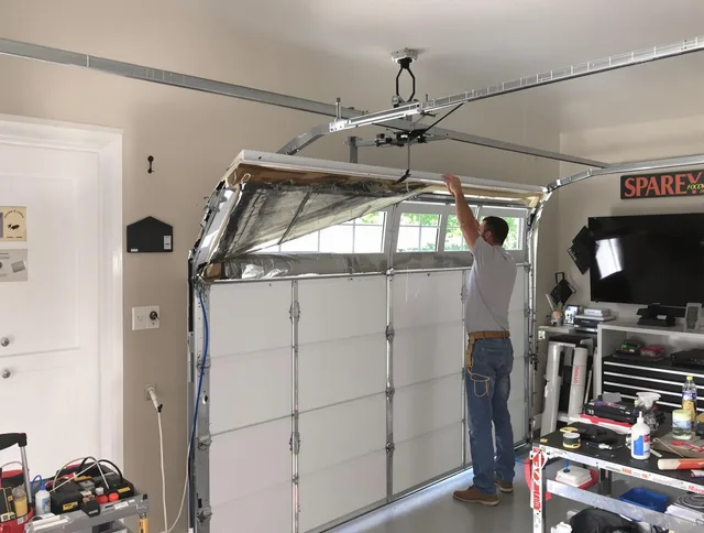Garage door section replacement by Port St. Lucie Garage Door Repair in Port St. Lucie