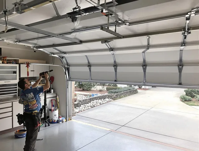 Garage door track repair service by Port St. Lucie Garage Door Repair in Port St. Lucie